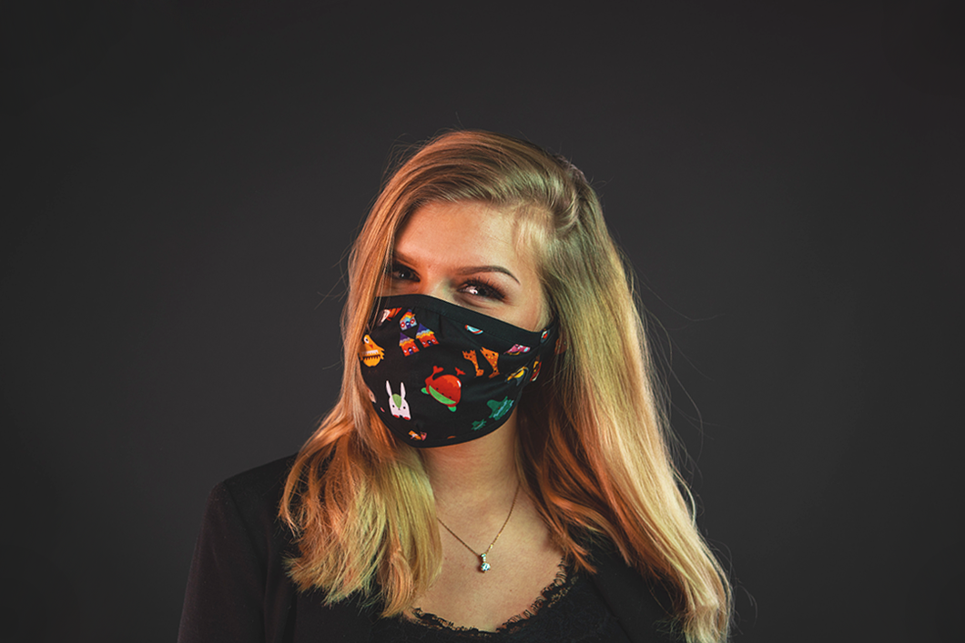 girl with reusable face mask with cartoon print